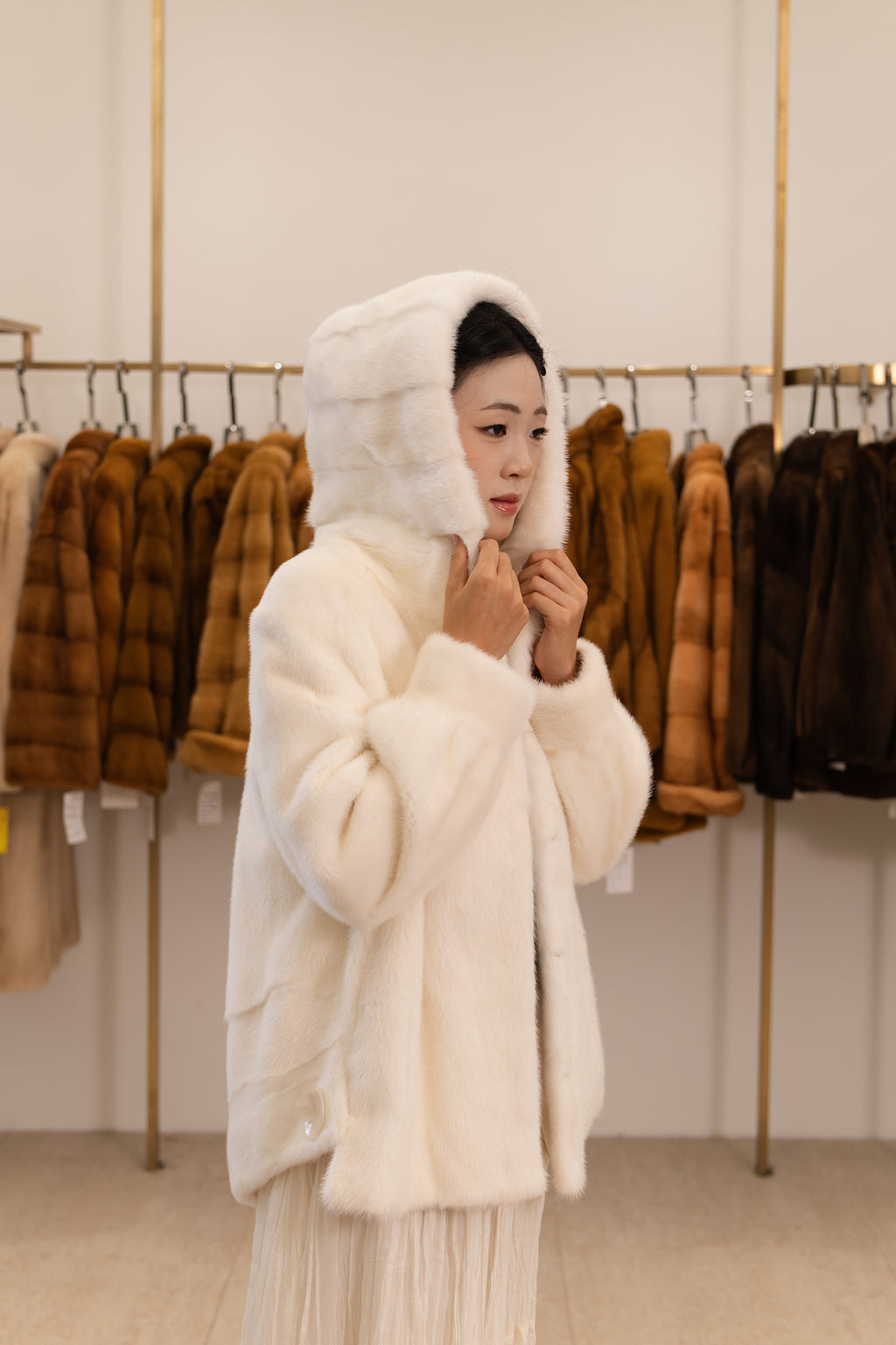 The Ivory White Hooded Mink Coat